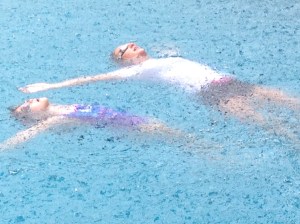 Elizabeth- Age 6 Elizabeth and Miss Katelyn floating on their backs during an afternoon rain shower! (no lightening or thunder were present at the time of lessons)