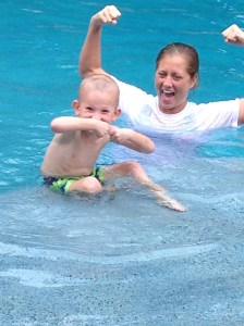 Hudson- Age 4 Showing off his strong muscles that he uses for his scoops in the water!